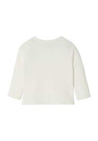 Cremfarbener Langarm-Top mit kleinen, hellen Pünktchen. Mit einem runden Halsausschnitt und gerippten Bündchen. Weiches, dehnbares Baumwollmaterial.