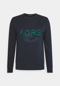 Sweatshirt blu navy con collo rotondo, maniche lunghe e un logo "KORS" ricamato verde testurizzato con un design circolare.