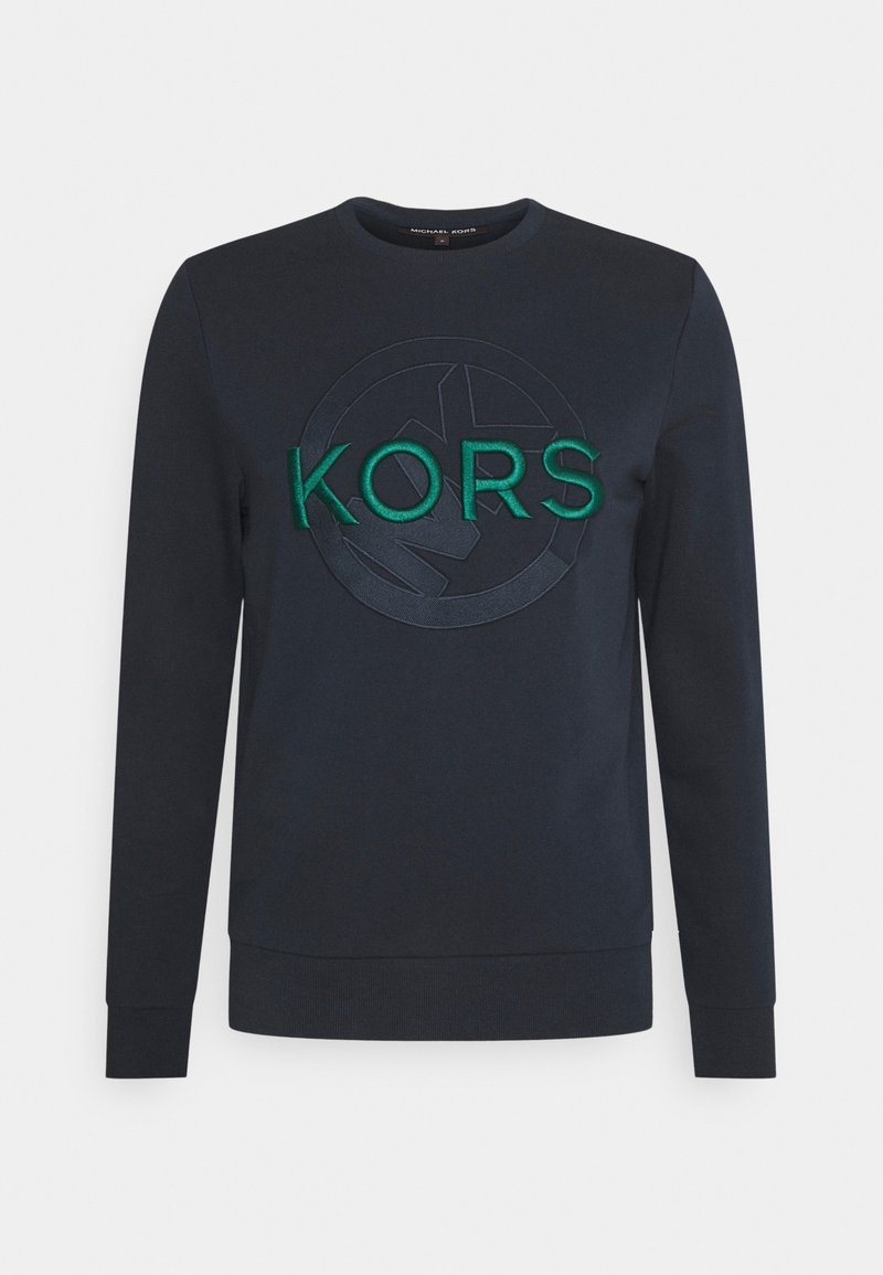 Sweatshirt blu navy con collo rotondo, maniche lunghe e un logo "KORS" ricamato verde testurizzato con un design circolare.