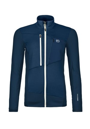 Navy blue athletic jacket with a stand collar, textured panels, white zippers, and logo. Features multiple zippered pockets and fitted design.