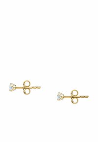 Goldene Stud-Ohrringe mit einem herzförmigen klaren Edelstein in einer Krappenfassung und einem schlichten Wirbel-Design am Stiel.