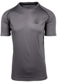 Camiseta deportiva de manga corta en gris, fabricada con un material suave y que absorbe la humedad. Presenta un sutil logo de gorila en el pecho y costuras en contraste.