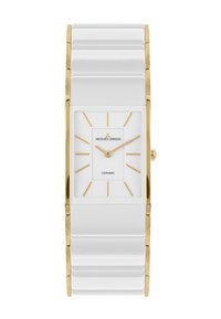Reloj de cerámica blanca con cara rectangular, acentos dorados y marcadores de horas minimalistas. Presenta una correa brillante y estriada.