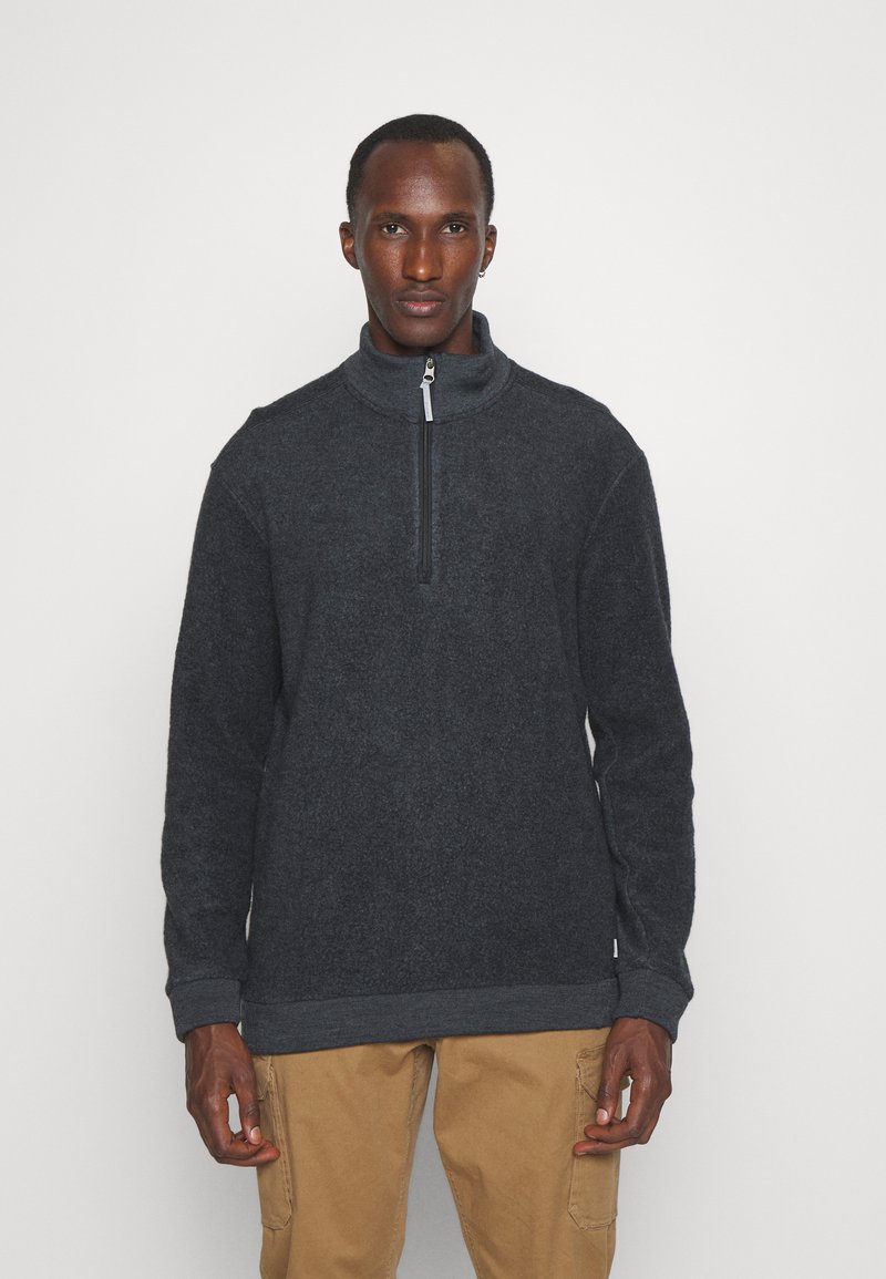 Dunkelgrauer Fleece-Pullover mit hohem Kragen und halbem Reißverschluss. Verfügt über gerippte Manschetten und Saum, die ein strukturiertes, weiches Erscheinungsbild bieten.