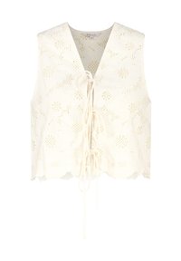 Top en dentelle couleur crème avec motif floral, décolleté en V, fermeture à nouer et ourlet festonné. Tissu texturé avec détails découpés.