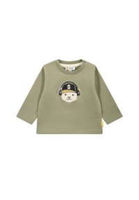 Maglietta a maniche lunghe verde oliva con una grafica di un orso con cuffie e cappellino. Realizzata in cotone morbido con una texture a coste. Accentuata da un'etichetta.