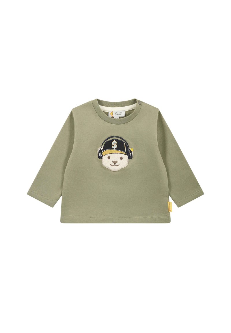 Maglietta a maniche lunghe verde oliva con una grafica di un orso con cuffie e cappellino. Realizzata in cotone morbido con una texture a coste. Accentuata da un'etichetta.