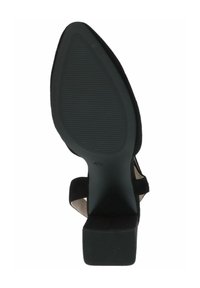 Zapato de tacón negro con una suela lisa y texturizada, correas abiertas y un diseño afilado. La altura del tacón es de aproximadamente 4.5 pulgadas.