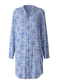 Camicia a maniche lunghe con un motivo floreale blu e verde su uno sfondo chiaro, con chiusura a bottoni e vestibilità rilassata.