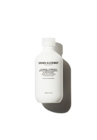 White bottle of Grown Alchemist volumizing shampoo, featuring a minimalist design, black text, and a rounded shape. 200ml capacity.