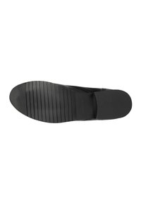 Suola di scarpa nera con una superficie texturizzata, dotata di scanalature orizzontali per garantire grip, punta arrotondata e un leggero tacco.
