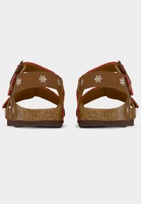 Καφέ σανδάλια με δύο ρυθμιζόμενα λουριά, διακοσμημένα με ροζ floral κέντημα στα λουριά και πάτο που μοιάζει με φελλό. Υφή στην εξωτερική σόλα για καλύτερη πρόσφυση.