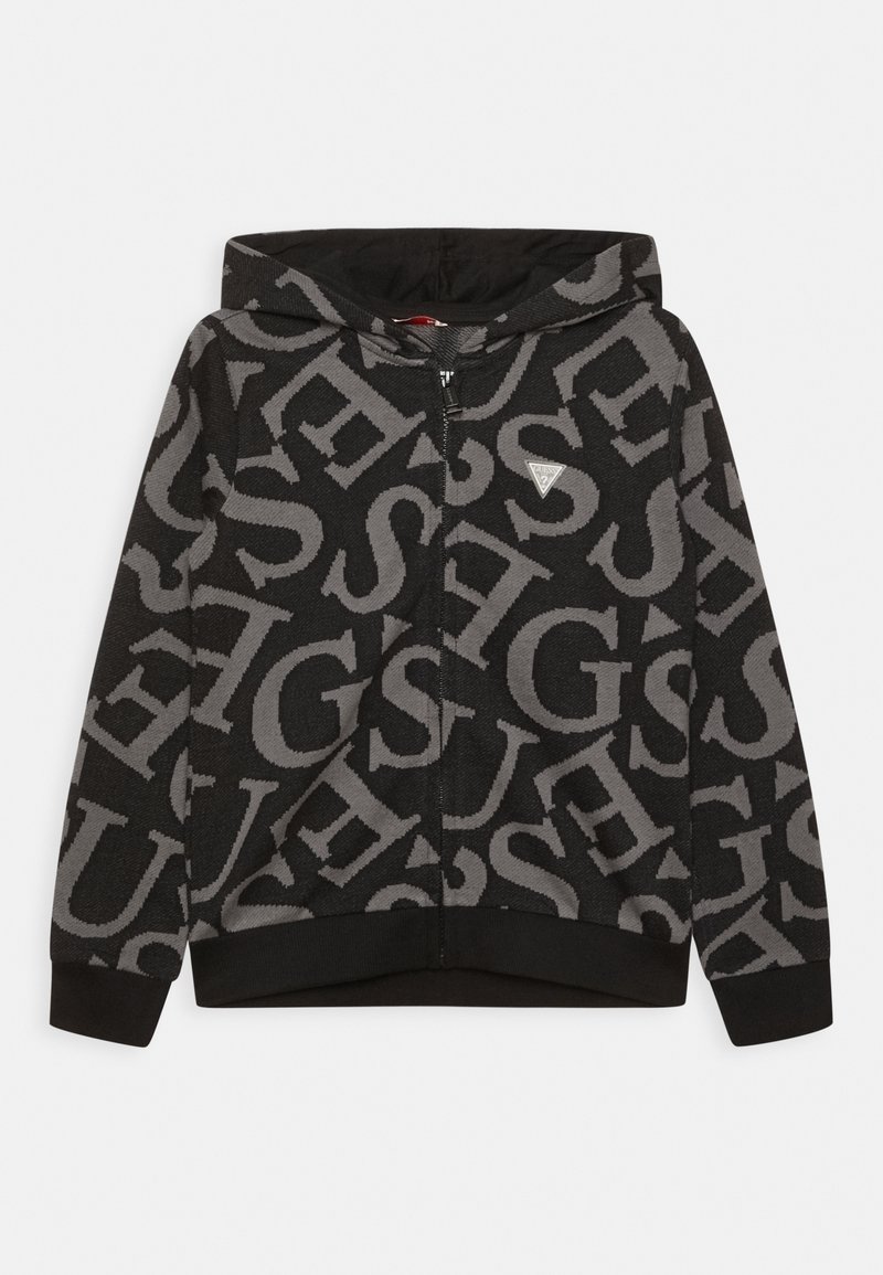 Sweat à capuche noir zippé avec de grandes lettres grises superposées et un petit logo triangulaire sur la poitrine, doté de poignets et d'un ourlet côtelés.