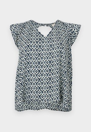 Mörkblå och vit mönstrad blus med V-ringning och små ärmar; geometrisk design och genomskinlig textur. Nyckelhålsdetalj bak.