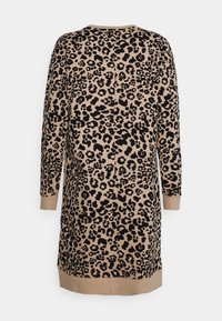 Vestido de estampado de leopardo con fondo beige y manchas negras, mangas largas y dobladillo acanalado. Fabricado con una tela suave y de corte holgado.