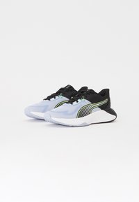 Athletic sneakers in light blue and black, featuring a textured upper, green accents, and a patterned side panel. Rubber outsole for grip.