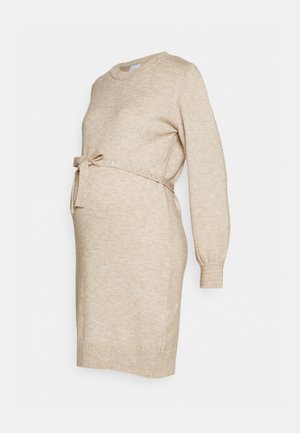 Beige maternity sweater dress with long sleeves, round neck, and a tie belt at the waist. Soft texture, knee-length design.