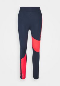 Leggings blu navy con accenti rossi; presentano un design aderente, una vita elasticizzata e dettagli con logo lungo il lato. Tessuto liscio e elasticizzato.