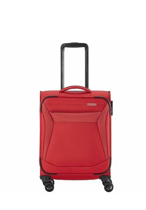 Red carry-on suitcase with a textured fabric exterior, retractable black handle, four black wheels, and a front zippered pocket for storage.