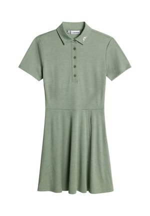 Groene polojurk met korte mouwen, een knopenplooi en een uitlopende rok. Gemaakt van een zachte, gestructureerde stof, met een subtiel logo op de kraag.