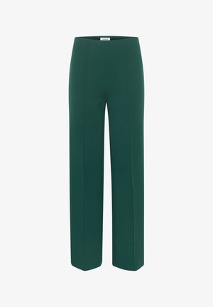 Kõrge vöökoht, sirged püksid tumerohelsest kangast. Omavad puhtaid jooni ja siledat tekstuuri, ilma nähtavate taskute või kaunistusteta.