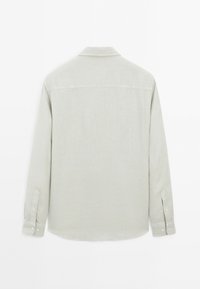 Light gray long-sleeve shirt with a collared neckline, button cuffs, and a smooth, textured fabric. Rear view shows a straight hem.