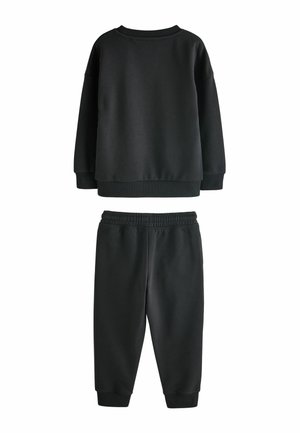 Black cotton sweatshirt and matching pants, featuring ribbed cuffs and waistband. Smooth texture with a relaxed fit and simple design.