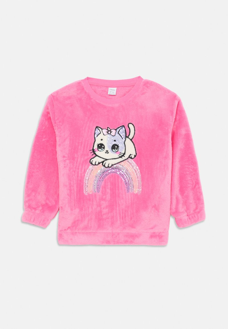 Bright pink children's sweatshirt with a cute cat face and bow resting on a sparkling pastel sequin rainbow design.