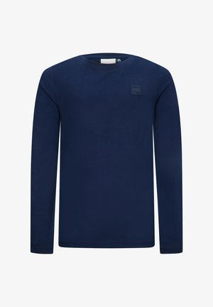 Marineblauwe longsleeve t-shirt van zachte stof, met een ronde halslijn en een klein zwart label aan de bovenkant aan de linkerkant.