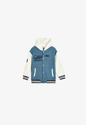 Hættetrøje varsity jakke i blå og hvid, med broderede logoer, trykknapper, sidelommer, stribede manchetter og en blød tekstur.