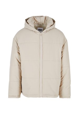 Béžová péřová bunda s kapucí, předním zipem, prošívaným vzorem a volným střihem. Vyrobena z měkkého materiálu, má elastické manžety.