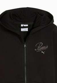 Čierna mikina s kapucňou na zips vyrobená z bavlnenej zmesi, s kapucňou, vyšitým logom "Puma" v bielej farbe a kontrastným šitím okolo zipsu.