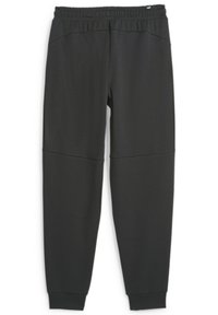Pantalones de chándal gris oscuro hechos de una tela suave, con una cinturilla elástica, piernas ajustadas y detalles de panel contrastante en los muslos.