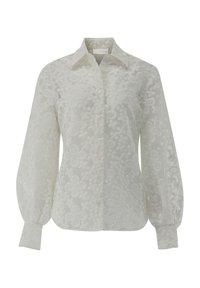 White floral-patterned blouse with a button-down front, long balloon sleeves, and a structured collar, made from sheer, textured fabric.