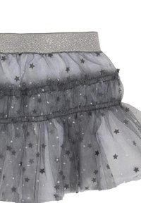 Gonna in tulle grigia con volants a strati, caratterizzata da motivi a stelle nere e paillettes. Vita elastica con finitura argentata luccicante.