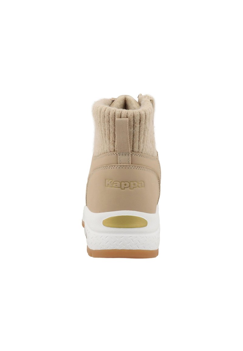Beige Knöchelschuh mit einem plüschigen, gestrickten Kragen, glattem Synthetik-Obermaterial, weißer Zwischensohle und Gummisohle; mit eingeprägtem Logo auf der Ferse.
