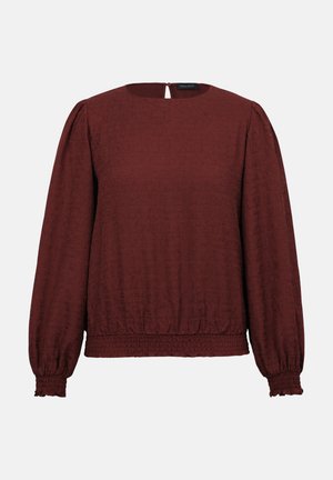 Dlhá bordová blúzka s textúrovaným vzorom, okrúhlym výstrihom, zapínaním na gombíky vzadu a elastickými manžetami a lemom.