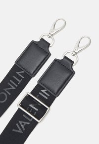 Black nylon strap with leather accents, featuring silver-tone metal clips and a rectangular buckle, displaying "VALENTINO" logo in gray.