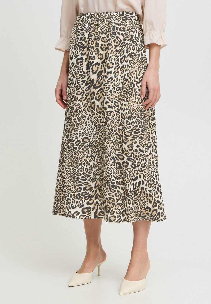 Leopard print midi skirt with an elastic waistband, made of lightweight fabric; features a flowing A-line shape and soft texture.