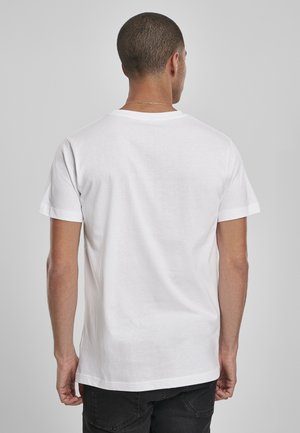 White cotton t-shirt with short sleeves, featuring a classic crew neckline. Visible neck seam and smooth texture, viewed from the back.