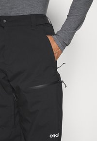 Oakley TNP LINED SHELL PANT 2.0 - Pantaloni de snowboard - blackout