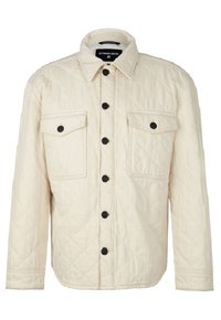Veste matelassée couleur crème avec manches longues, boutons noirs sur le devant et sur deux poches poitrine, et col pointu.