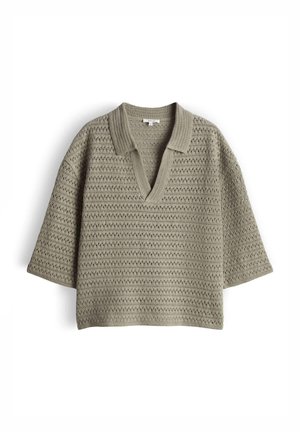 Light olive green short-sleeve knitted sweater with open collar and textured pattern, loose fit, laid flat on white background.