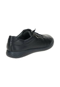 Black leather shoe with a textured surface, featuring a side zipper, round toe, and a flexible rubber sole with a patterned grip.