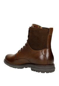 Stivali alla caviglia in pelle marrone con finitura liscia, dettagli in suede e interno a motivo. Presentano un design con lacci e suola robusta.