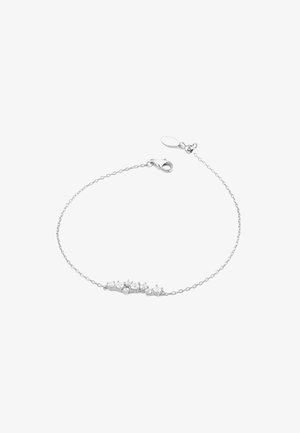 Srebrna bransoletka łańcuszkowa z rzędem pięciu gwiazdkowatych przezroczystych kamieni szlachetnych, z zapięciem typu lobster oraz regulowaną długością ze względu na małe ogniwa.