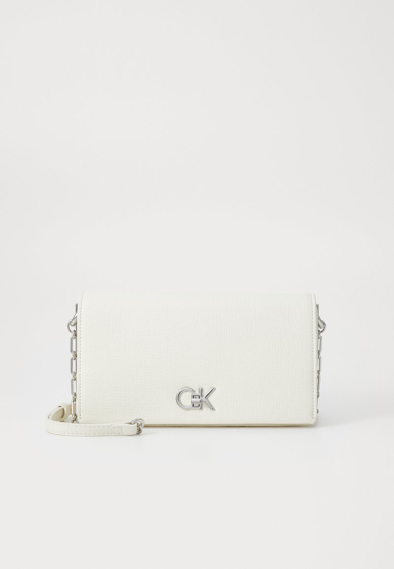 White textured crossbody bag with silver hardware and chain accents, featuring a logo on the front and a detachable shoulder strap.