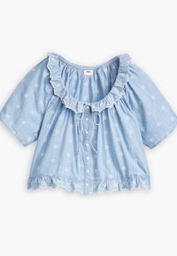 Blouse en coton bleu clair à manches courtes, décolleté volanté, broderie florale blanche, devant à boutons et ourlet festonné.