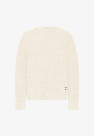 Pull en crème pelucheux avec des manches longues, un col rond et une étiquette sur le côté affichant "STD" et un cœur. Texture douce, coupe décontractée.