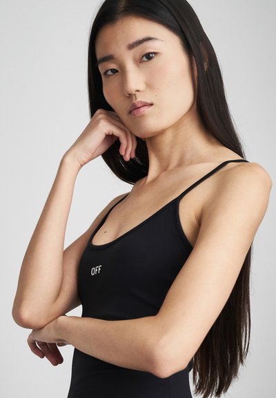Schwarzes ärmelloses Top mit großem Ausschnitt und "OFF"-Schriftzug. Glattes, elastisches Material und slim fit betonen das minimalistische Design.
